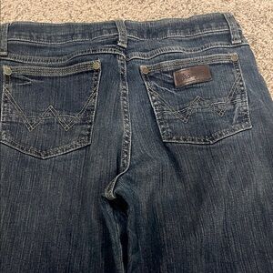 Wrangler Slim Straight Retro Jeans in Dark Blue with Brown Stitching